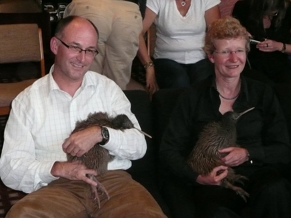 Tim Cossar, Chief Executive of the Tourism Industry Association and Minister of Conservation Kate Wilkinson with two rare juvenile rowi kiwi that were released into the wild as part of DoC's 50th anniversary celebrations